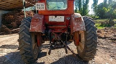 другой: Трактор колесный, класс тяги около 1,4–2,0. Кабина закрытая — 1