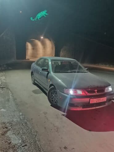 значок на авто: Nissan Primera: 2000 г., 2 л, Автомат, Бензиновая, Седан — 7