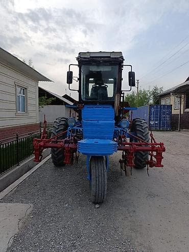 монипулятор кант: Колёсный трактор с навесным культиватором/сеялкой (междурядная — 4