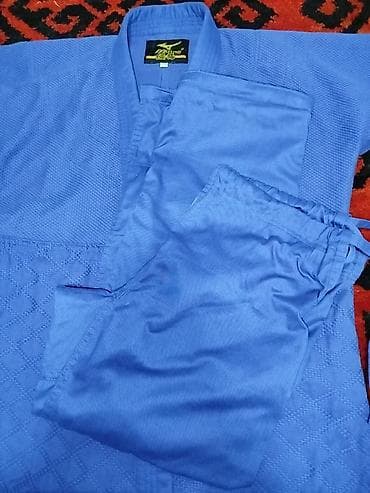 курты: Кимоно (кимоно-куртка и штаны) для дзюдо, синего цвета. Особенности — 2