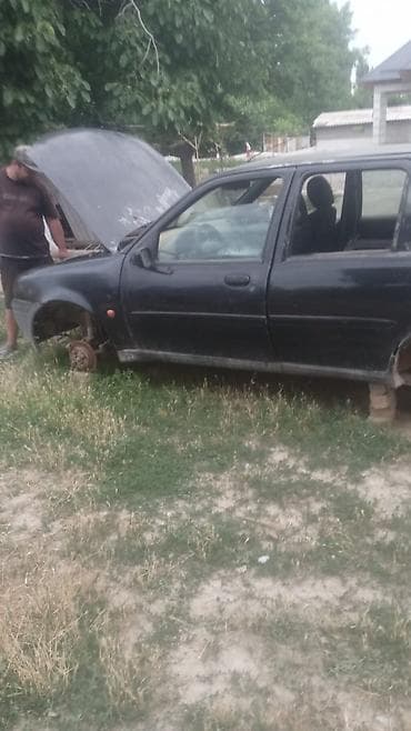 pasat b5: Ford Fiesta, хэтчбек 5‑дверный, черный цвет, номер К944УТ 32 RUS — 2