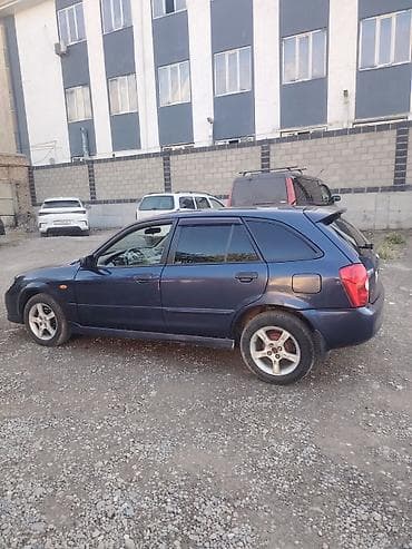 subaru forester 2001: Mazda 323: 2002 г., Механика, Хэтчбэк — 6
