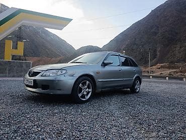 daf 480: Mazda 323: 2002 г., 1.6 л — 1