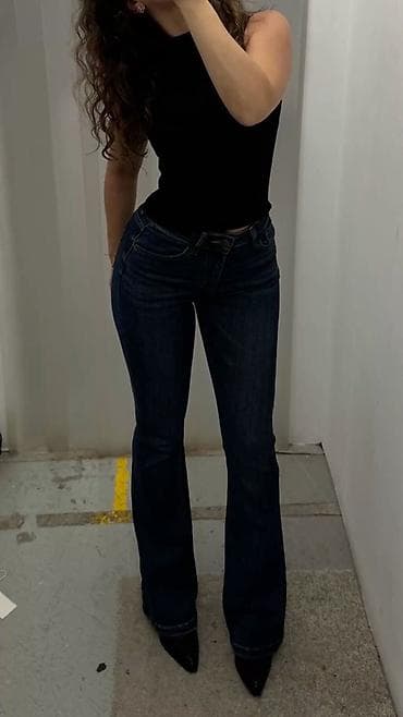 женские барсетки: Джинсы клёш женские, тёмно‑синего индиго оттенка. - Посадка — 1