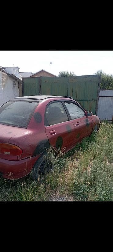 Mazda 121: 1994 г., 1.3 л, Кол менен иштөөчү, Бензин, Седан — 4