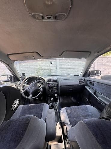 Унаа: Mazda 626: 1997 г., 1.8 л, Кол менен иштөөчү, Бензин, Седан — 5
