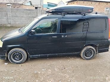 электирик авто: Минивэн/микроавтобус черного цвета с установленным багажным боксом на — 1