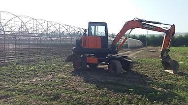 купить колесный экскаватор бу: Экскаватор, Doosan, 1999 г., Колесный — 10
