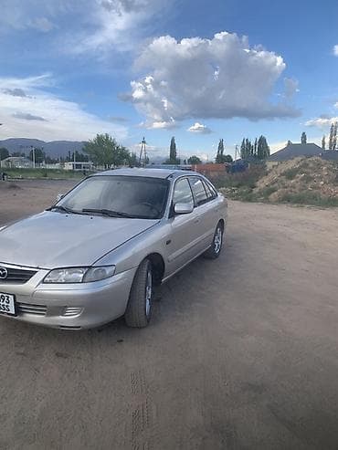 илизон машына: Mazda Capella: 1998 г., 2 л, Кол менен иштөөчү, Бензин, Седан — 3