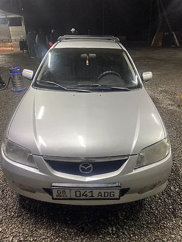 фара демио: Mazda 323: 2002 г., 1.6 л, Бензин, Хэтчбэк — 1