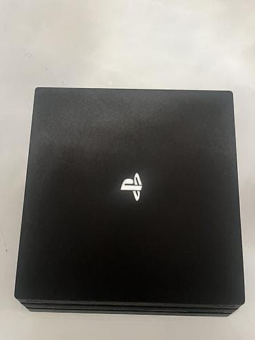 Видеоигры и приставки: PlayStation 4 Pro (чёрная) с двумя беспроводными геймпадами DualShock — 2