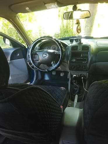 Mazda: Mazda 323: 2001 г., Механика, Бензин, Универсал — 4