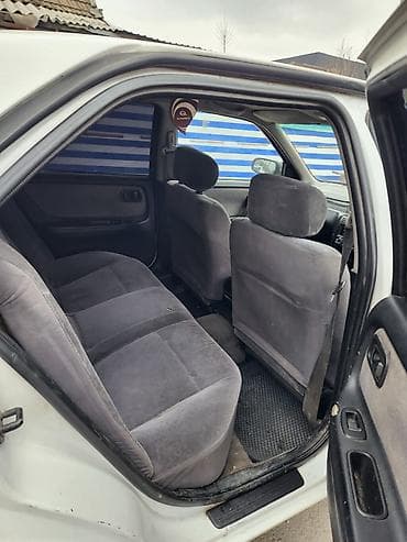 diska 14: Nissan Bluebird: 1997 г., Автомат, Бензин, Седан — 10