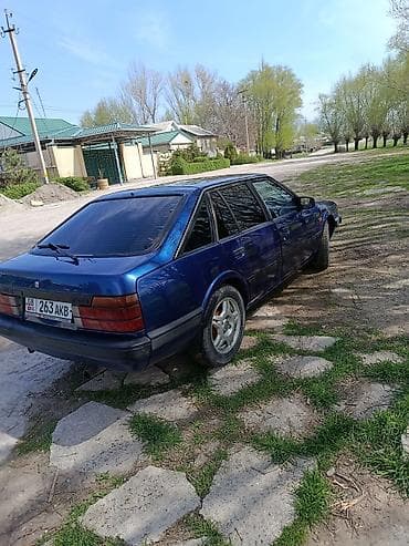 двери демио: Mazda 626: 1987 г., Лифтбек — 3