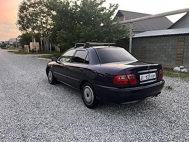 муссо автомобиль: Mitsubishi Carisma: 2000 г., Газ, Седан — 6