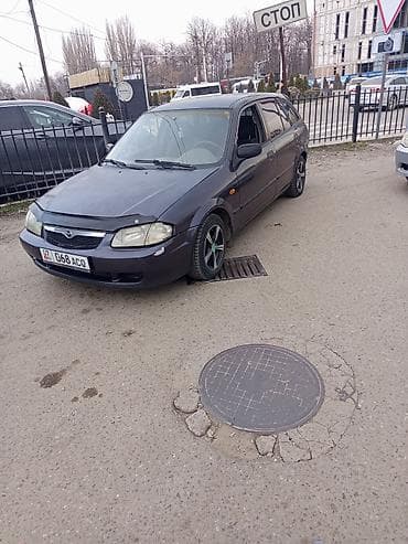 лобовое демио: Mazda 323: 1999 г., 1.5 л, Ручные, Бензин, Хэтчбэк — 1