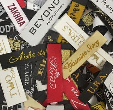 пакеты с логотипом: Тканевые этикетки вшивники для одежды на заказ с Вашим логотипом — 1