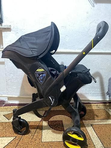 Детская коляска-трансформер Doona (автокресло 0+ со встроенной ходовой