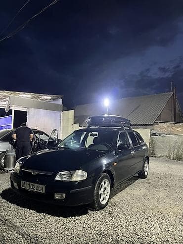 мини трак: Mazda 323: 1999 г., 1.6 л, Механика, Бензин, Хэтчбэк — 4