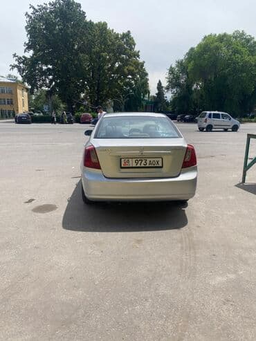 чекол машина: Suzuki Forenza: 2009 г., 2 л, Автомат, Бензин, Седан — 4