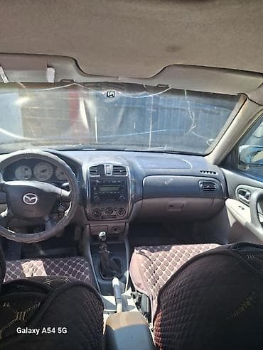 янтарный: Mazda 323: 2002 г., 1.6 л, Ручные, Бензин, Хэтчбэк — 6