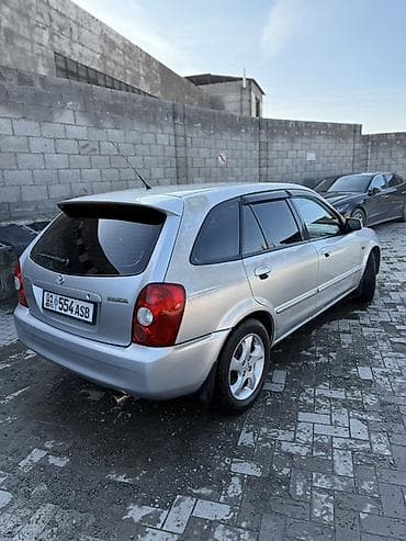 w210 e280: Mazda 323: 2003 г., 1.6 л, Механика, Бензин, Универсал — 4