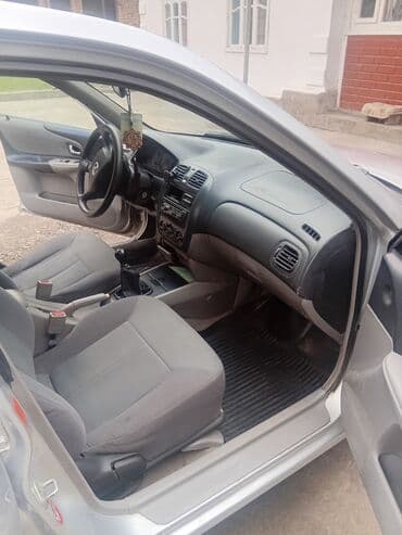 автомобиль бу: Mazda 323: 2003 г., 1.3 л, Механика, Бензин, Хетчбек — 5