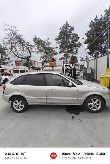 Mazda Familia: 2001 г., Универсал — 5