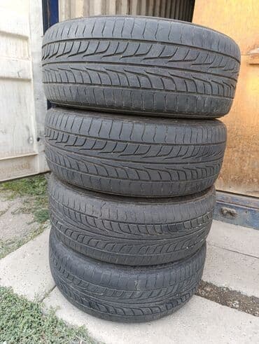 новые шыны: R-18 -215-45. Привозные из Японии. Шины летние комплект 4 шт. По нашим — 1