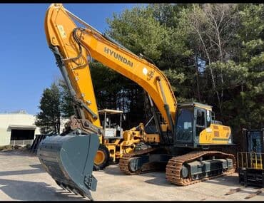 шины на эксковатор: Колесный экскаватор Hyundai, выполненный в характерной для бренда — 4