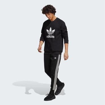 Толстовки: Adidas. Уютный пуловер, отражающий наследие adidas. Логотип — 3