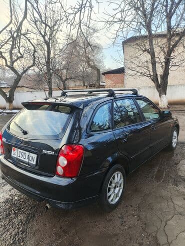 Mazda 323: 2003 г., 1.6 л, Механика, Бензин, Универсал