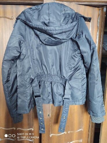 Продается б.у. теплая женская курткакоричневого цвета в хорошем