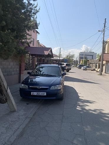 Mazda Familia: 2001 г., Механика, Бензин, Универсал