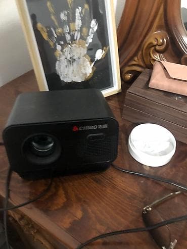 видео няни: Проектор CHIGO (портативный) - Компактный мультимедийный проектор в — 1