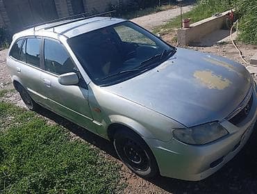 Унаа: Mazda 323: 2000 г., 1.6 л, Кол менен иштөөчү, Бензин, Хетчбек — 3