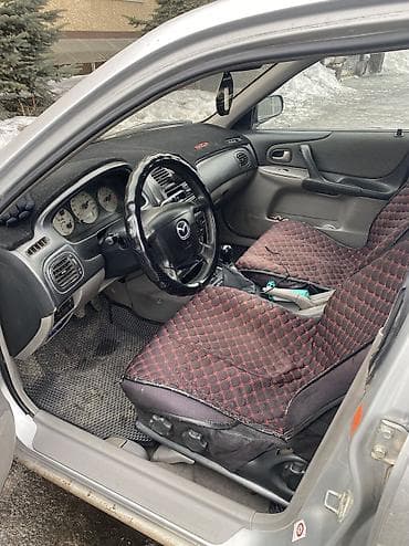 180 sx: Mazda 323: 2002 г., 1.6 л, Механика, Бензин, Хэтчбэк — 5