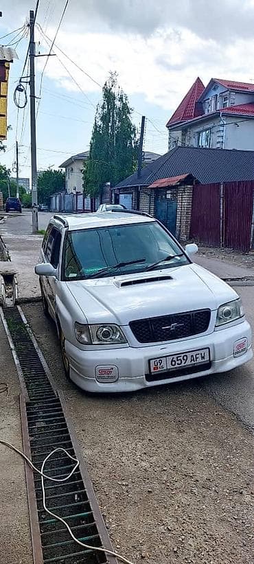 выхлоп sti: Subaru Forester: 2000 г., 2 л, Автомат, Бензин, Универсал — 1