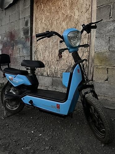 Унаа: Электроскутер Gigini SK — компактный городской транспорт в голубом — 1