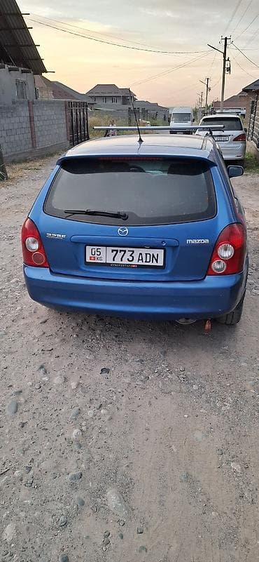 Mazda 323: 2002 г., Механика, Бензин, Хэтчбэк — 4