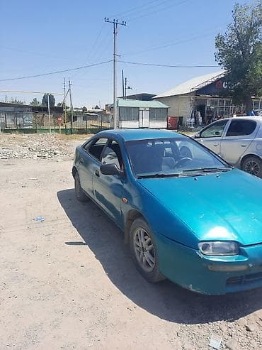 mini cooper: Mazda 323: 1995 г., Хэтчбэк — 5