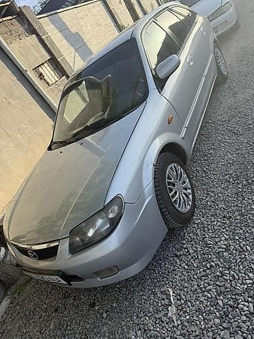 колонка microlab: Mazda 323: 2002 г., 1.6 л, Механика, Бензин, Универсал — 6