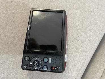 купить бинокль никон: Компактная цифровая фотокамера Nikon COOLPIX L25 (бордовый цвет) — 3