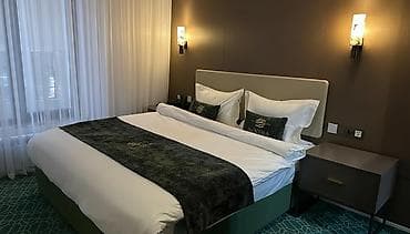 Стильный номер в гостинице NOOMA Inn Описание: - Уютная спальня с