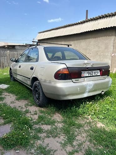 купить гоночную машину: Mazda Familia: 1996 г., Механика, Бензин, Седан — 2