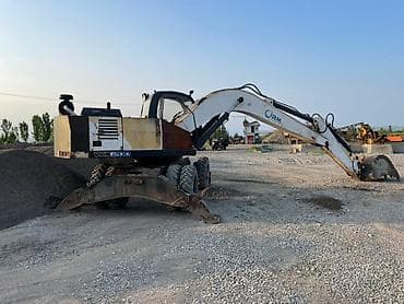 штанговый мотор или цепной: Экскаватор, 2003 г., Колесный — 3