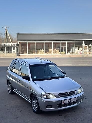 step vagon: Mazda Demio: 2003 г., 1.3 л, Ручные, Бензин, Универсал — 1