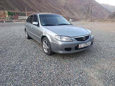 daf 480: Mazda 323: 2002 г., 1.6 л — 7