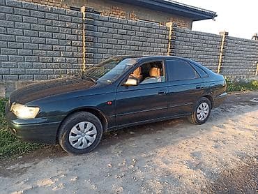 Toyota Carina E: 1994 г., 1.6 л, Механика, Бензин, Седан