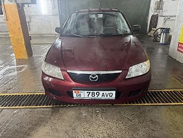 Mazda 323: 2002 г., 1.5 л, Механика, Бензин, Хэтчбэк